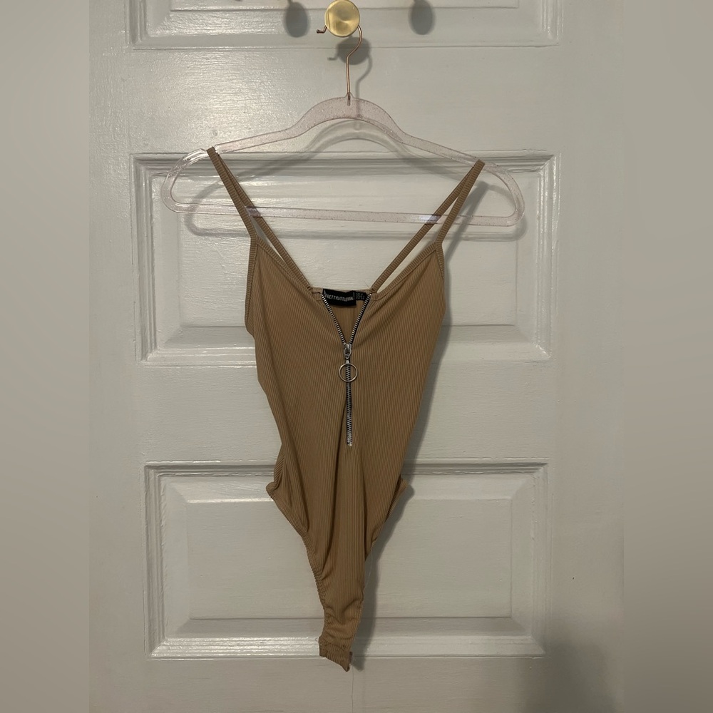 PrettyLittleThing Beige Ribbed Zipper Bodysuit